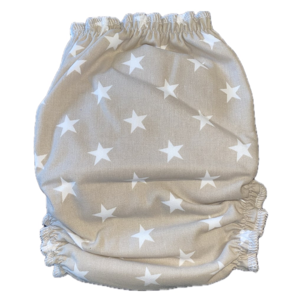 Stoffwindel Rückseite aus Baumwolle. Beige mit weißen Sternen